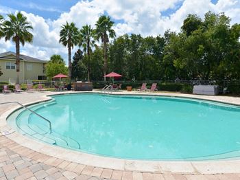 Pool lounge chairs umbrellas 